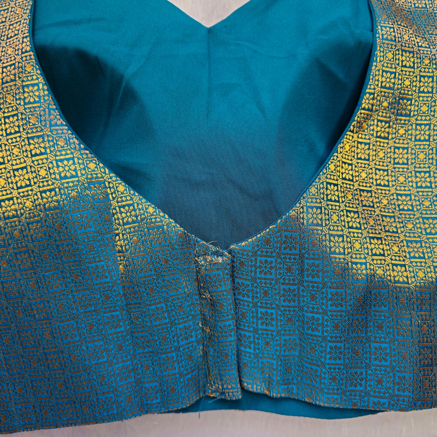 Turquoise With Gold Zari Brocade Sleeveless Blouse